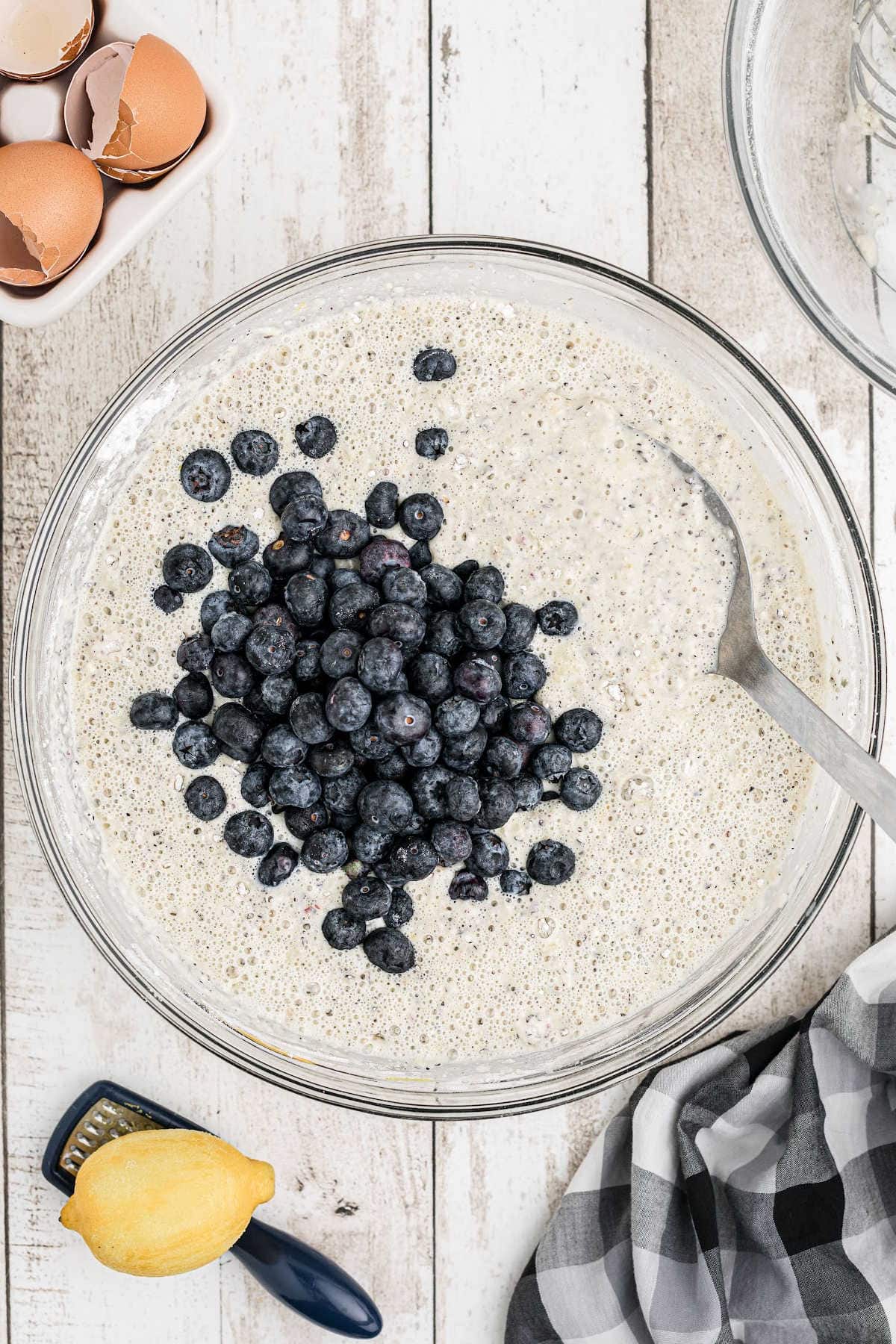 The wet and dry ingredients have been combined into a batter and blueberries added.