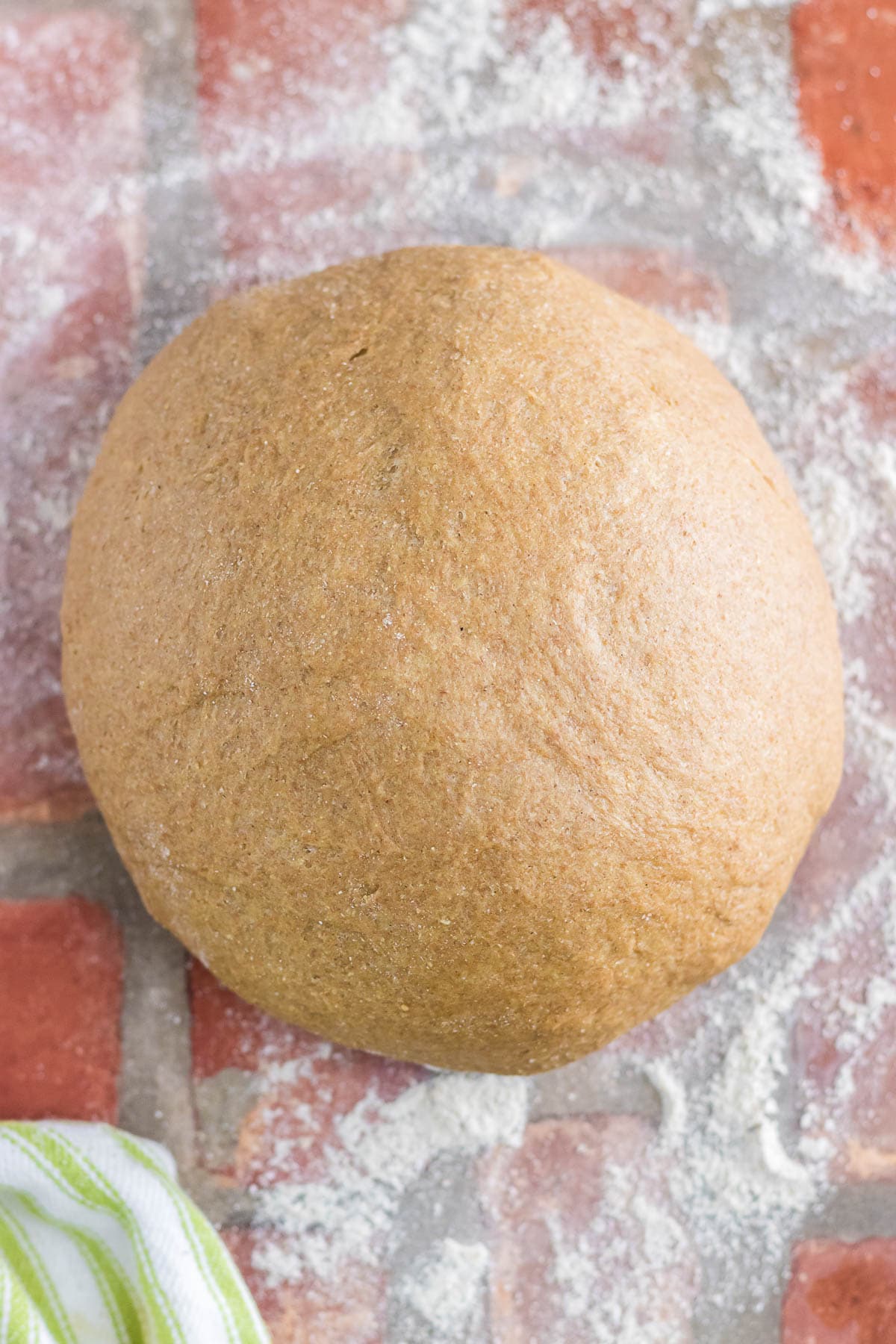 Finished dough has been kneaded and formed into a ball to rise.