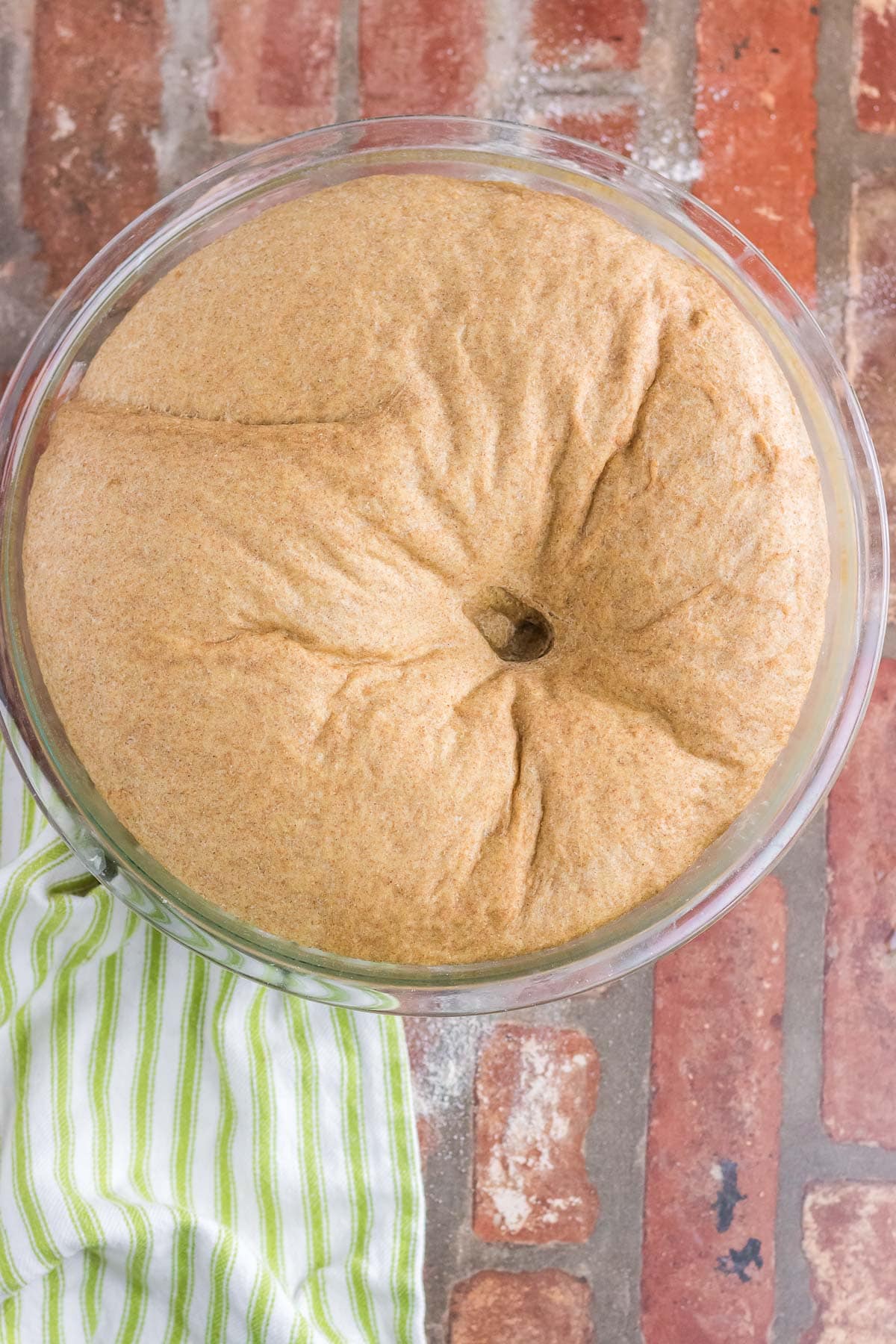 Risen dough is punched down.