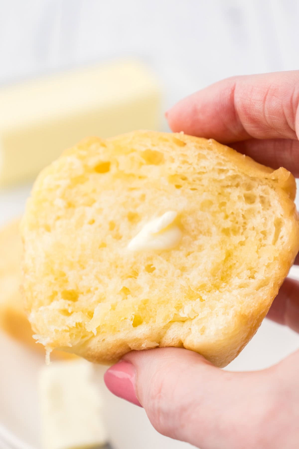 A roll cut open to show the soft, fluffy inside.