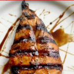 Overhead view of Dr Pepper glazed chicken breast with title text overlay for Pinterest.