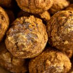 Closeup of baked pumpkin muffins topped with a sprinkle of sugar.