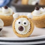 Polar bear cookies on a white plate.