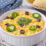 Taco dip in a white bowl.