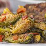 Closeup of brussels sprouts with hot bacon dressing.