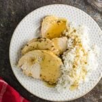 Overhead view of turkey breast slices on a plate.