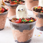 Halloween dirt cups with chocolate pudding, Oreos, and Nutter Butter ghosts.