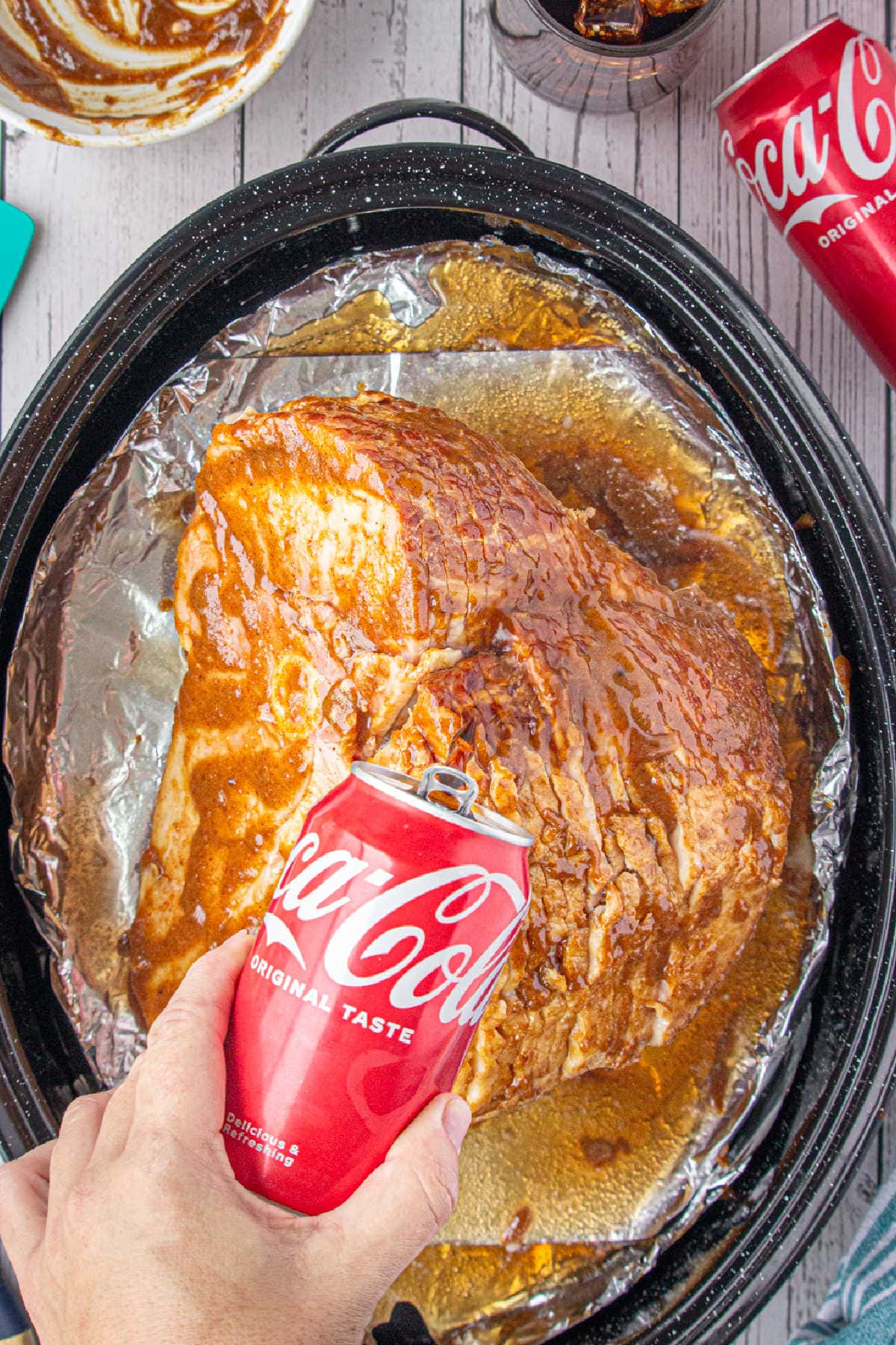 Coca Cola beng poured over the ham.