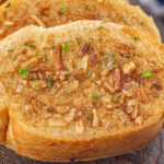 Close up of French onion garlic bread.