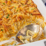 Closeup of the finished onion casserole in a white casserole dish.