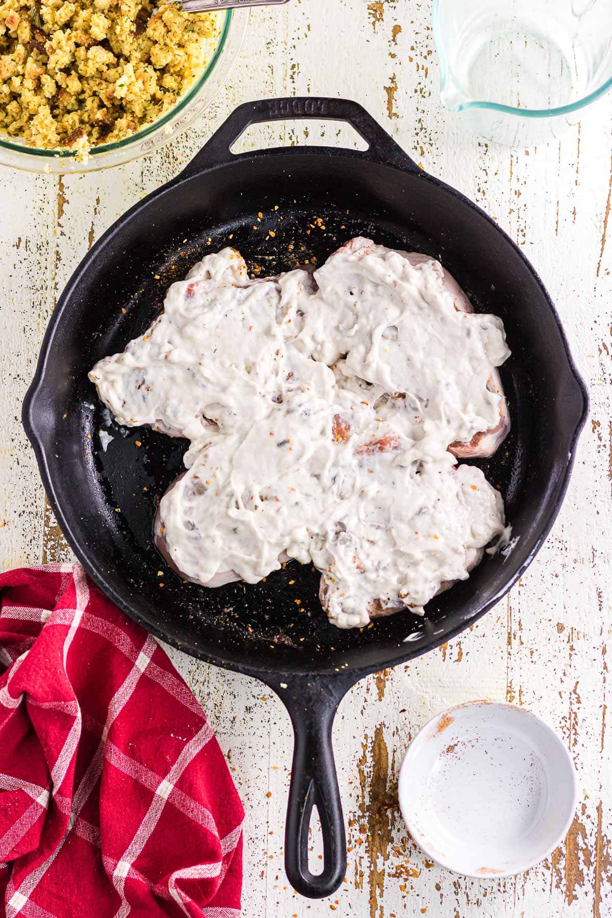 The cream of mushroom soup spread over the pork chops.