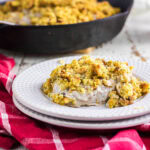 Pork chops and stuffing on a plate.
