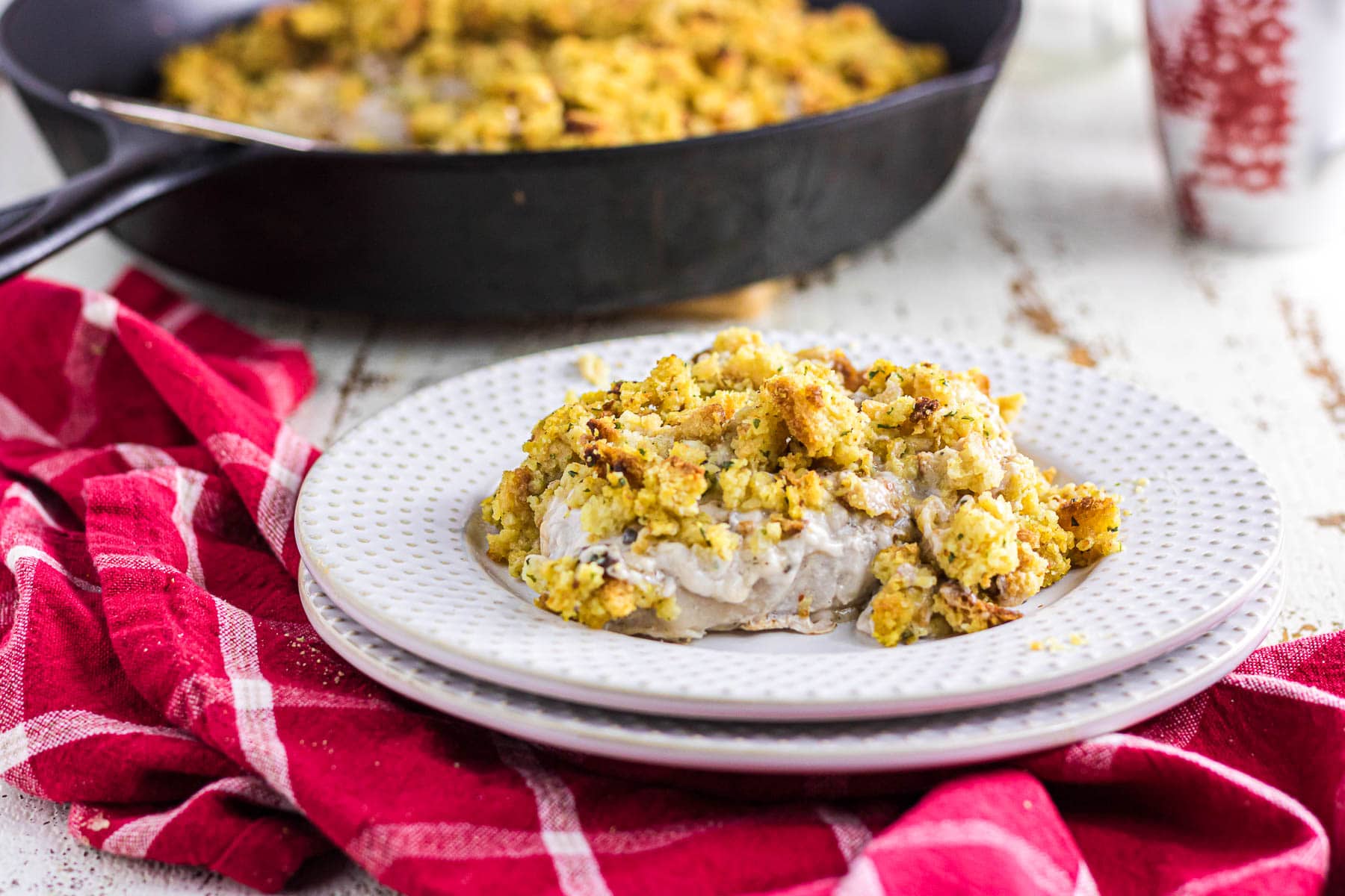 Pork chops and stuffing on a plate.