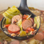 A ladleful of soup being served.