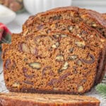 A loaf of Date Nut Bread sliced.