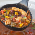 Ladleful of chicken fajita soup.