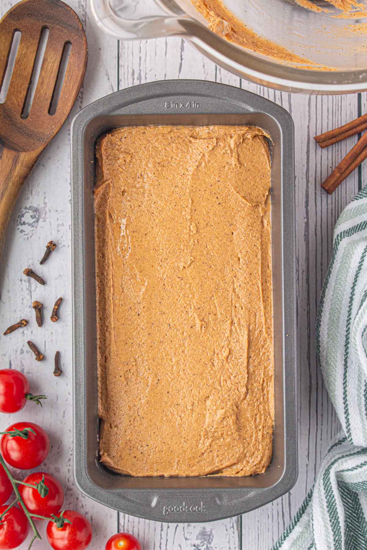 The tomato cake batter spread in a loaf pan.