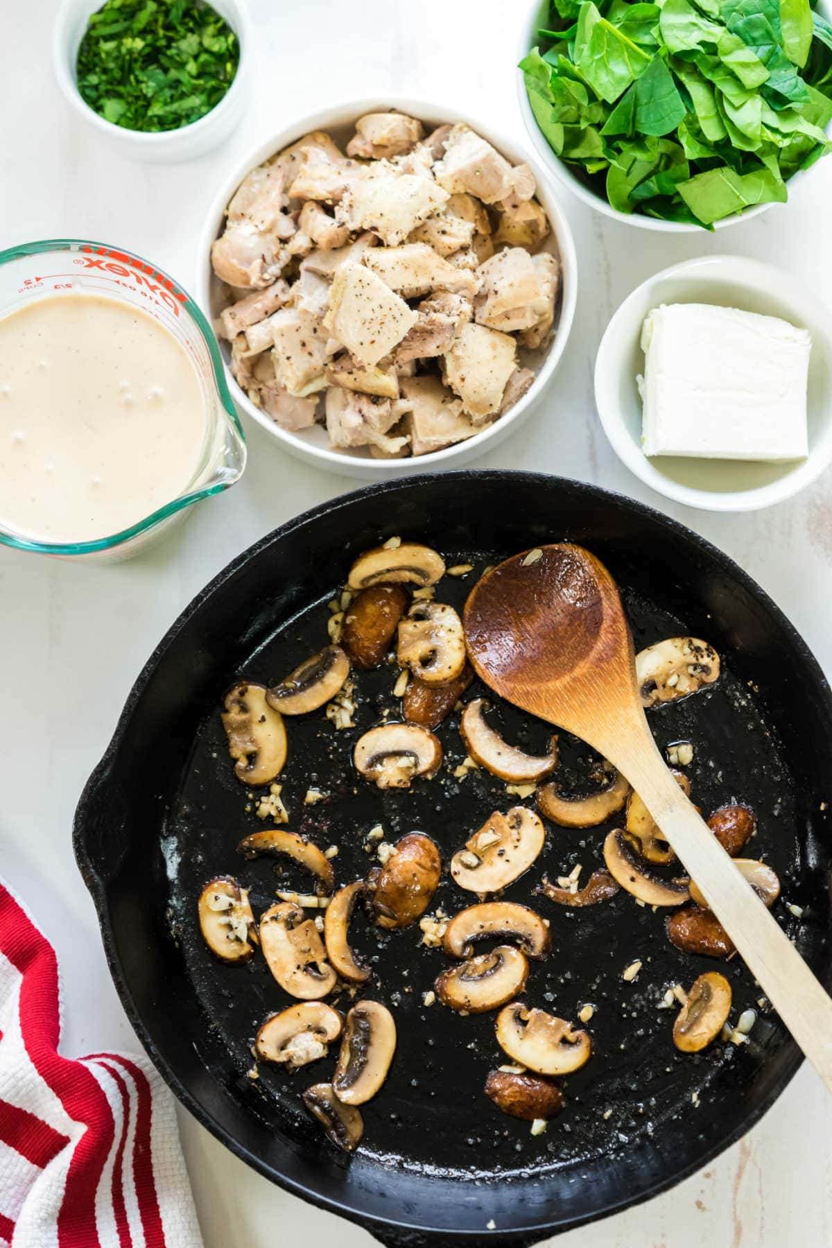Sauteeing mushrooms in a pan.