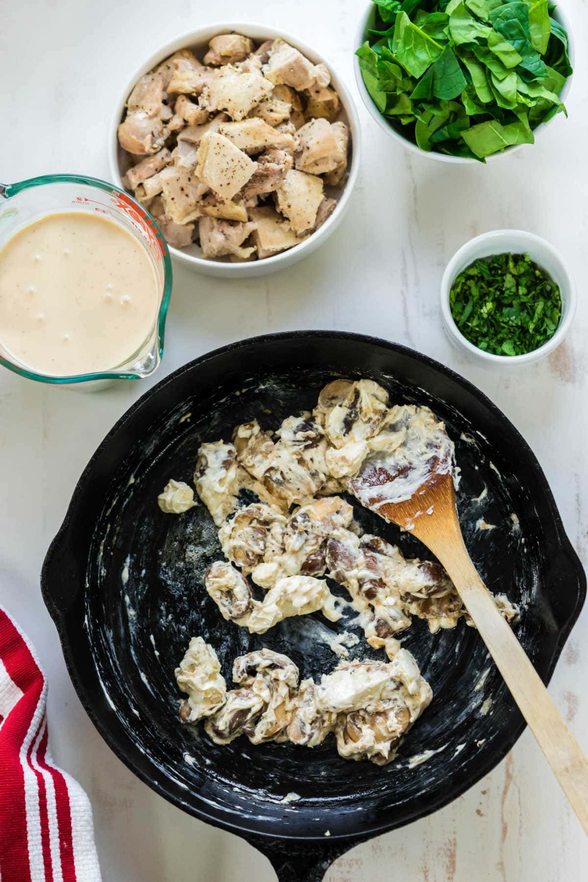 Chicken being cooked in the pan.