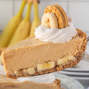 A slice of peanut butter banana icebox pie showing the layers of banana and peanut butter filling.