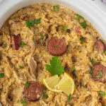 Overhead view of chicken bog in a crockpot with a title text overlay for Pinterest.