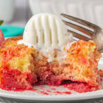 Strawberry shortcut cake, a vintage recipe, on a white plate with ice cream melting on top.