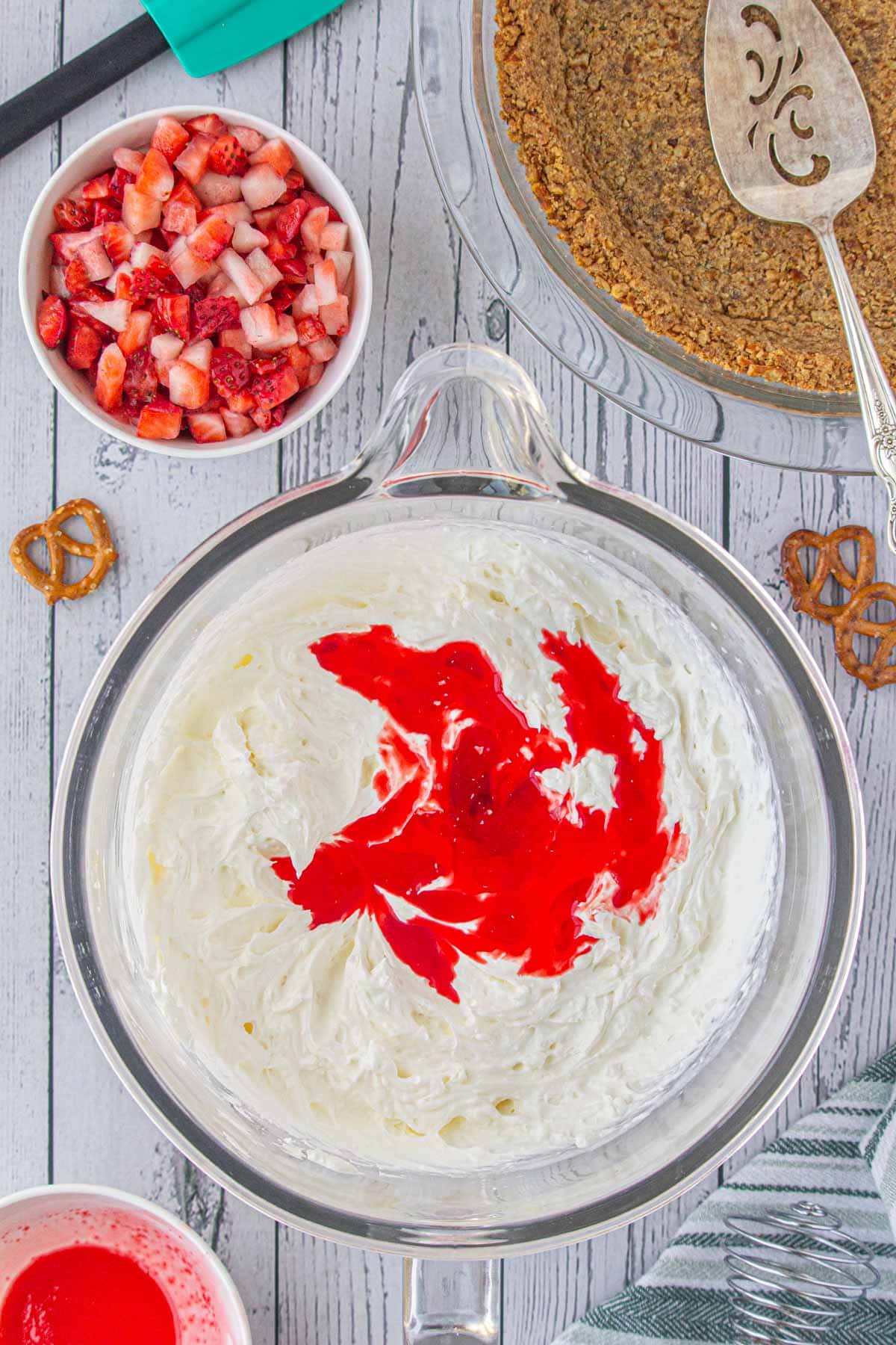 Jello being added to cream cheese mixture.