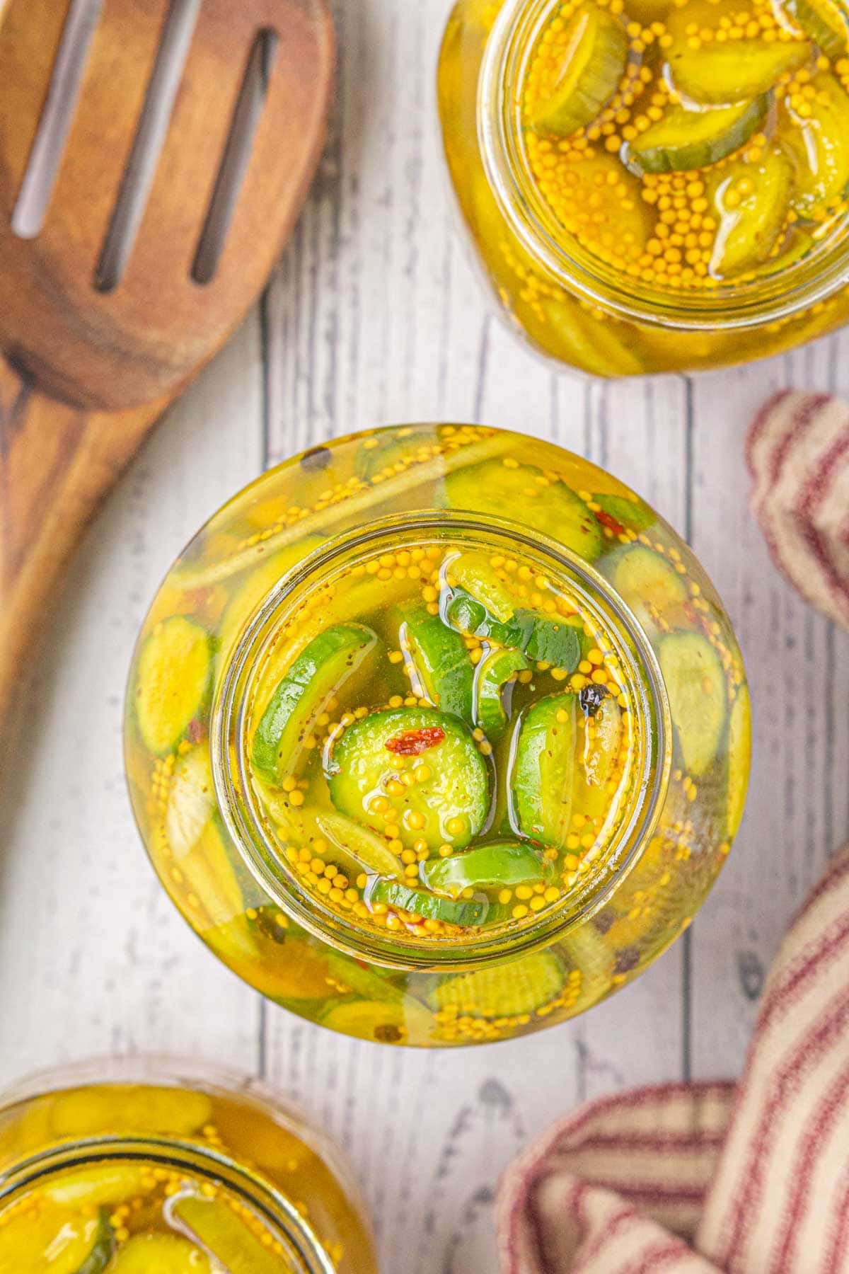 Overhead view of jars of finished pickles.
