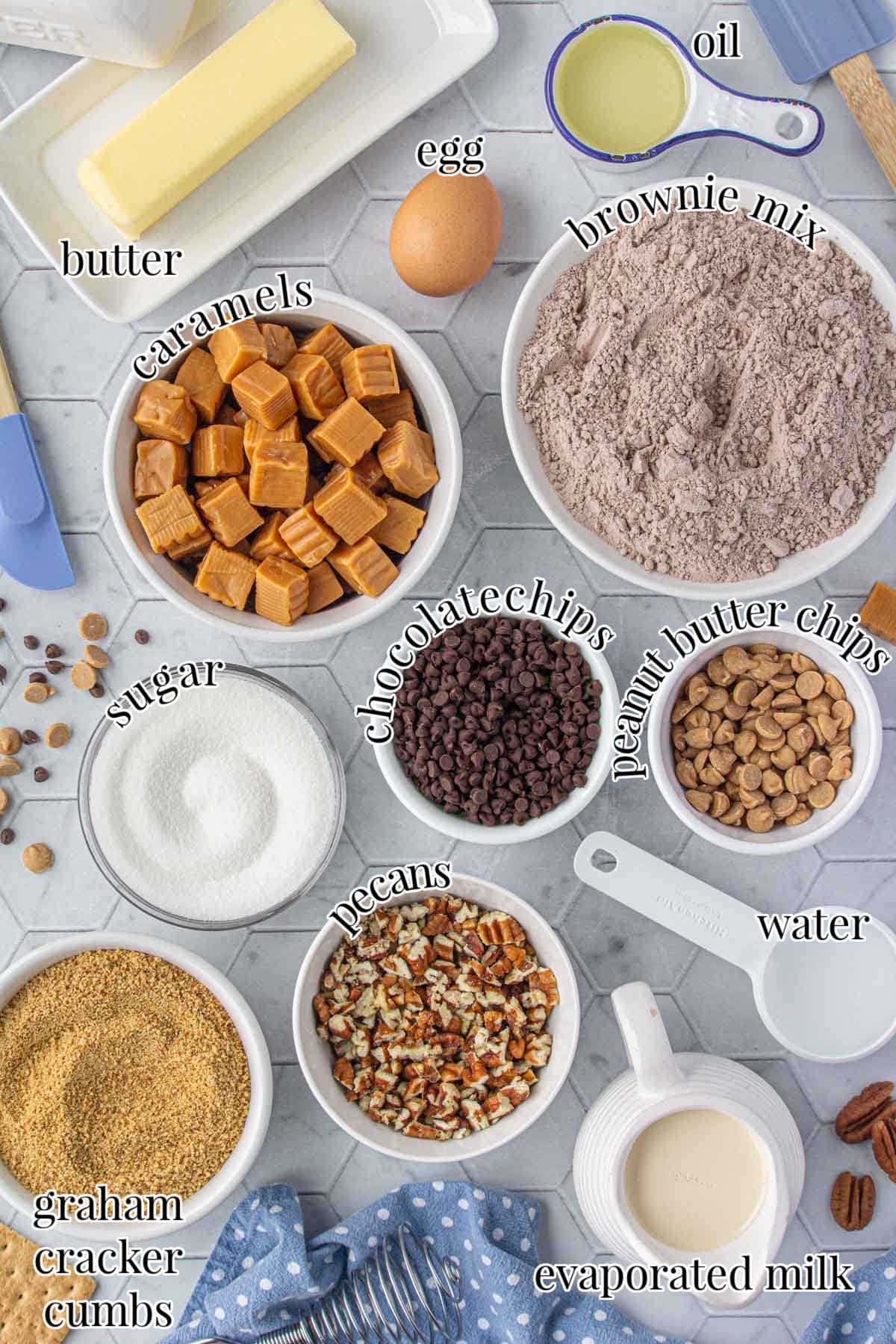 Ingredients for fudge brownies with gooey caramel and graham crust.