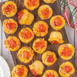 Overhead view of cheddar ham cups on a cutting board.