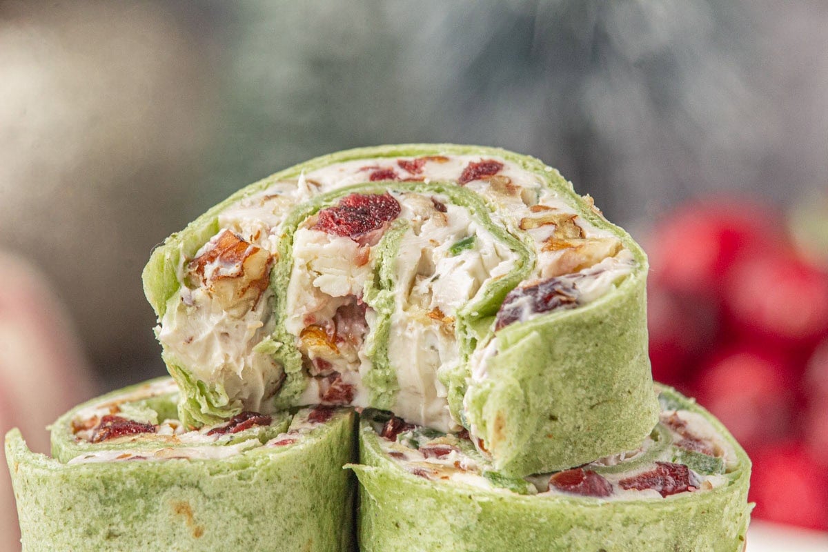 Closeup of cranberry pinwheel appetizers showing the filling.