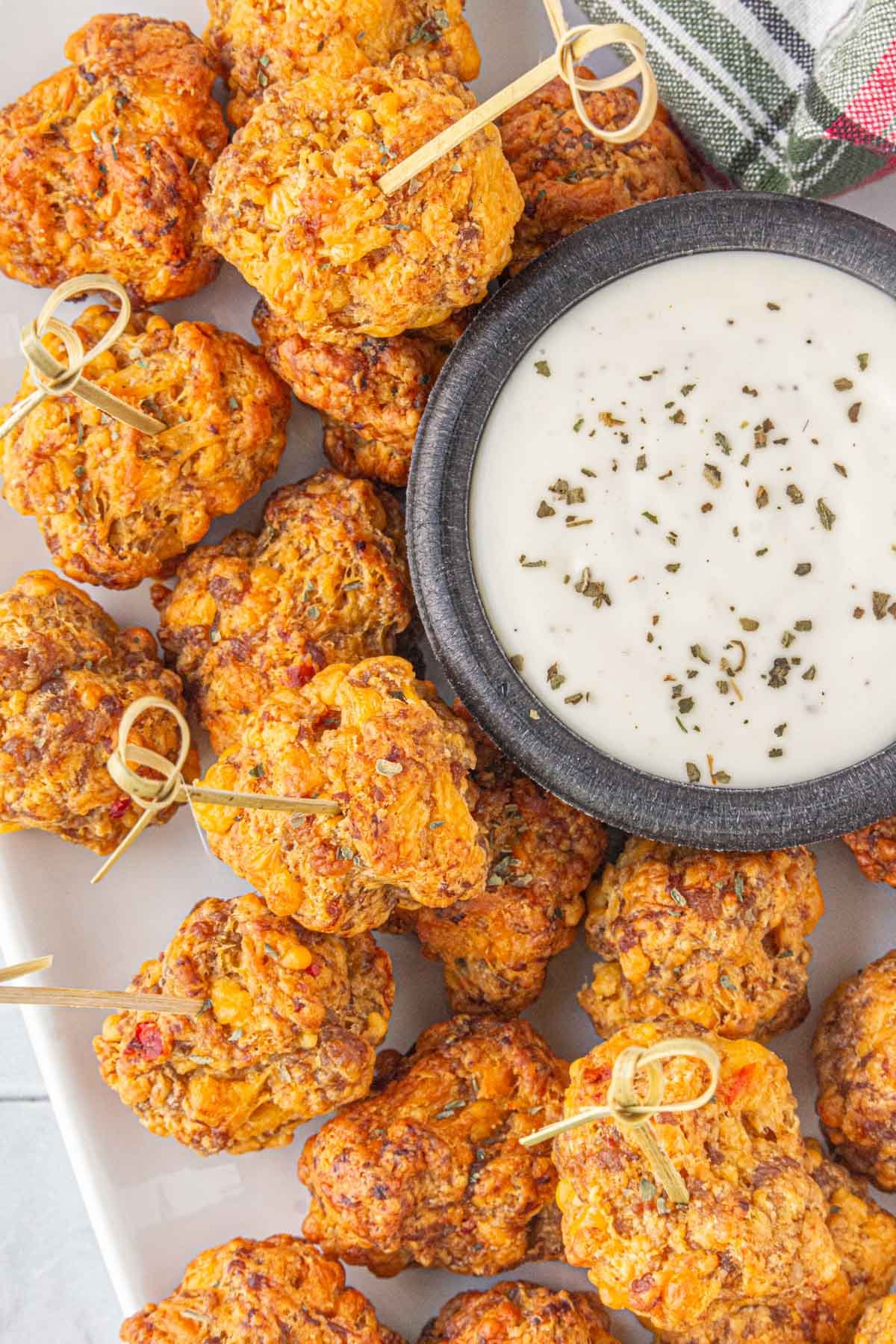 Overhead view of the homemade pimento cheese sausage balls on a serving platter.