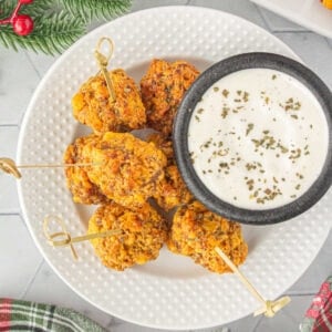 Overhead view of pimento cheese sausage balls appetizer with jalapeno ranch dip.