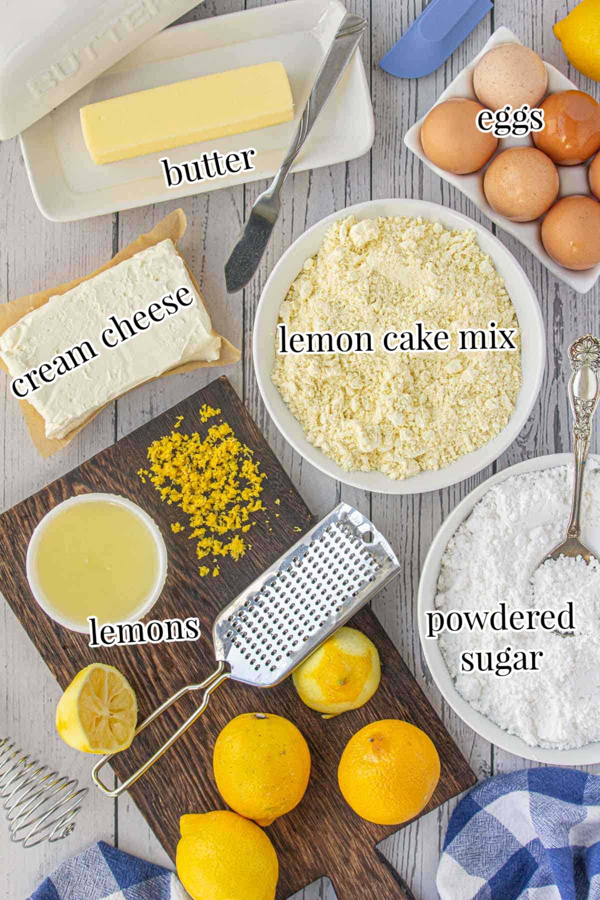 Labeled ingredients for lemon chess bars including butter, eggs, lemon cake mix, and cream cheese.