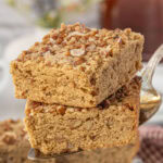 Homemade maple pecan blondies on a server, easy blondie recipe with maple syrup and toasted pecans.