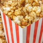 Cracker jack in a red and white striped box with text overlay for pinterest.