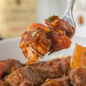 Crockpot Guinness beef stew finished and ready to serve in white slow cooker