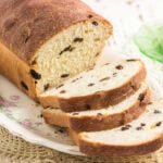 Old-fashioned raisin bread loaf with thick slices showing tender crumb and scattered raisins