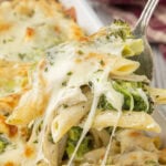 baked chicken broccoli alfredo casserole with creamy sauce and melted cheese being served