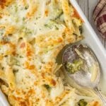 chicken and broccoli alfredo casserole baked with melted cheese in casserole dish easy weeknight dinner with text overlay for Pinterest.