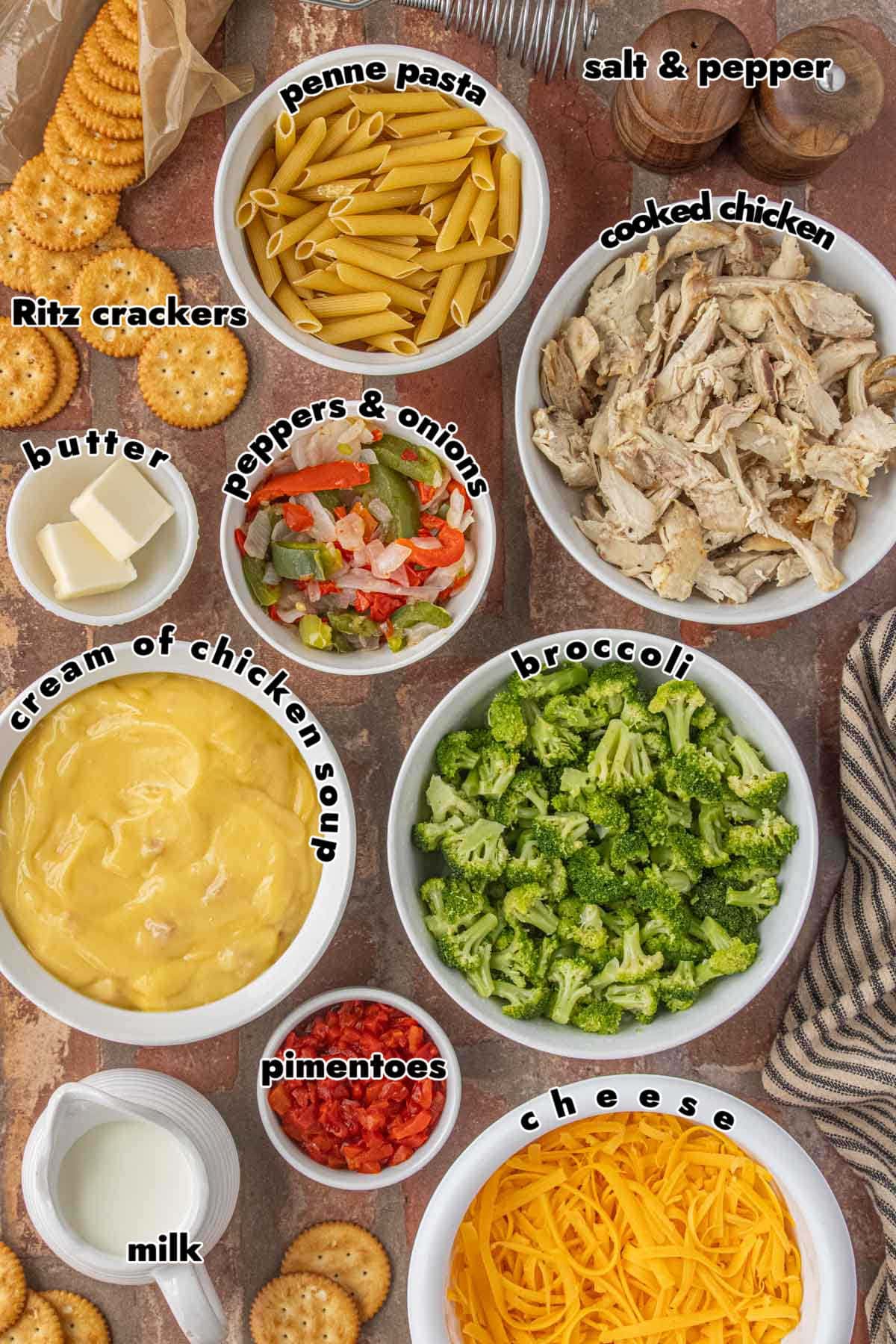 ingredients for pimento cheese chicken casserole including chicken broccoli pasta cheese and cream of chicken soup