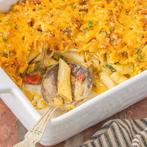 Creamy pimento cheese chicken casserole with broccoli and penne pasta baked with cheddar topping.