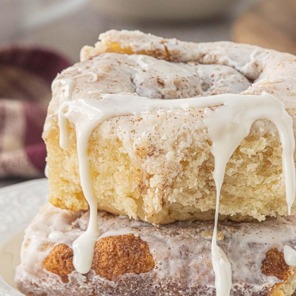 Easy no yeast cinnamon rolls with 2-ingredient dough topped with sweet icing and cinnamon.