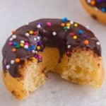 Image of a donut with chocolate glaze and a bite taken out of it with text overlay for Pinterest.