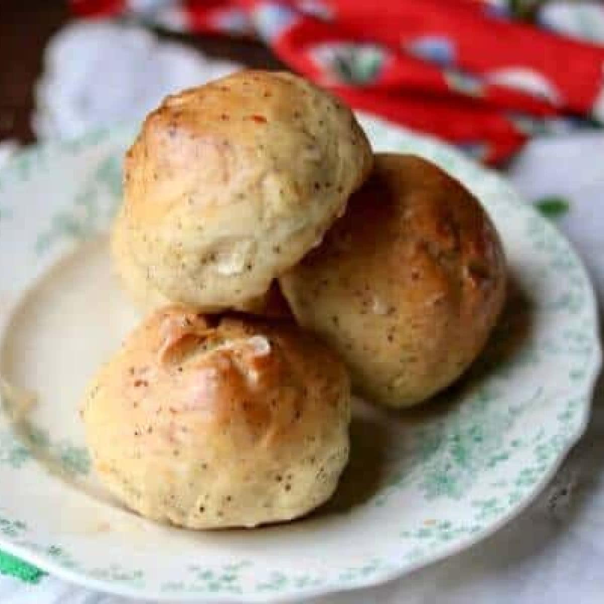 Easy cheese and black pepper dinner rolls on a plate.
