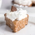 A slice of Hershey's chocolate pie on a white plate.