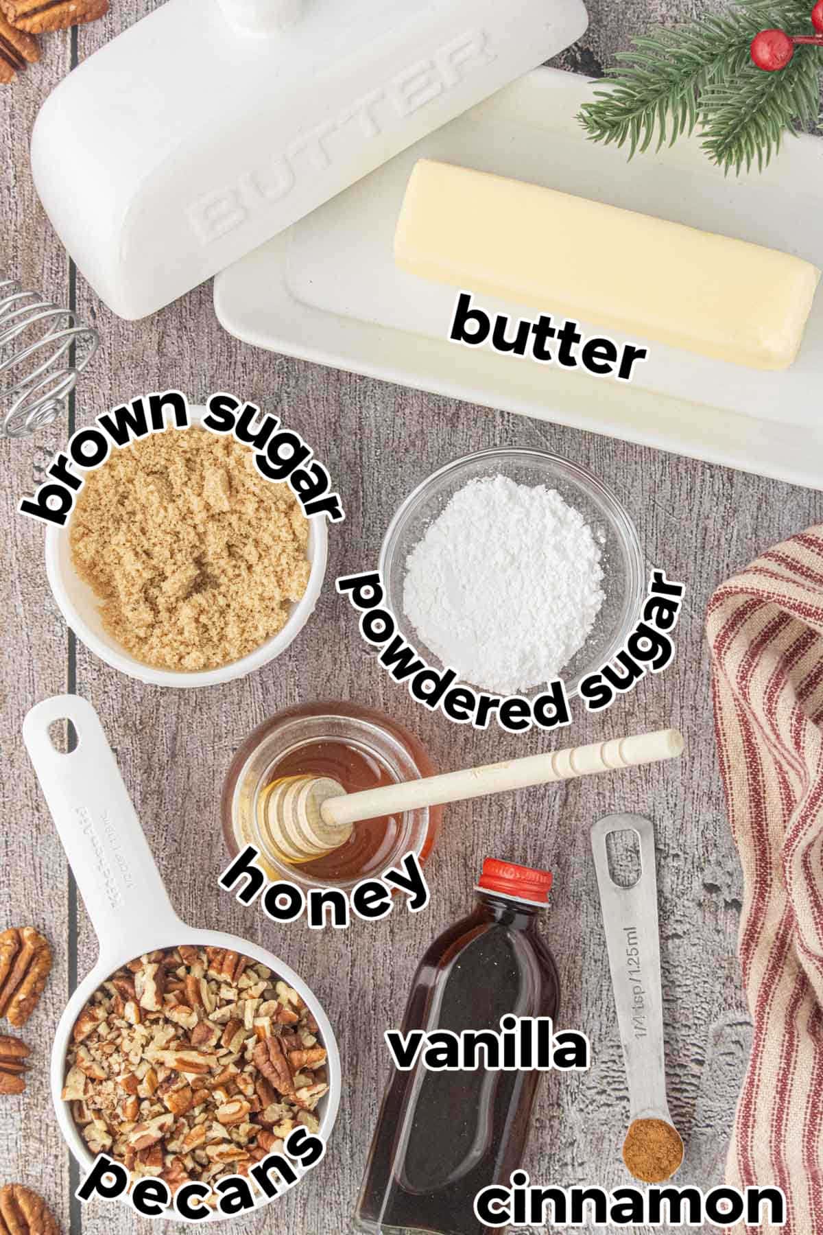 Ingredients for pecan praline honey butter including butter, brown sugar, powdered sugar, honey, vanilla, cinnamon, and chopped pecans.