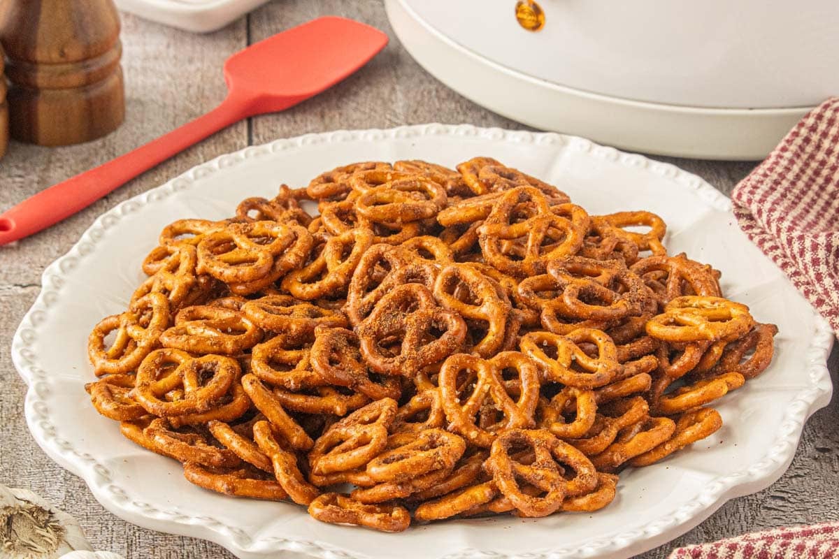 Seasoned taco pretzels on a white serving platter with crispy, buttery coating visible on every pretzel.