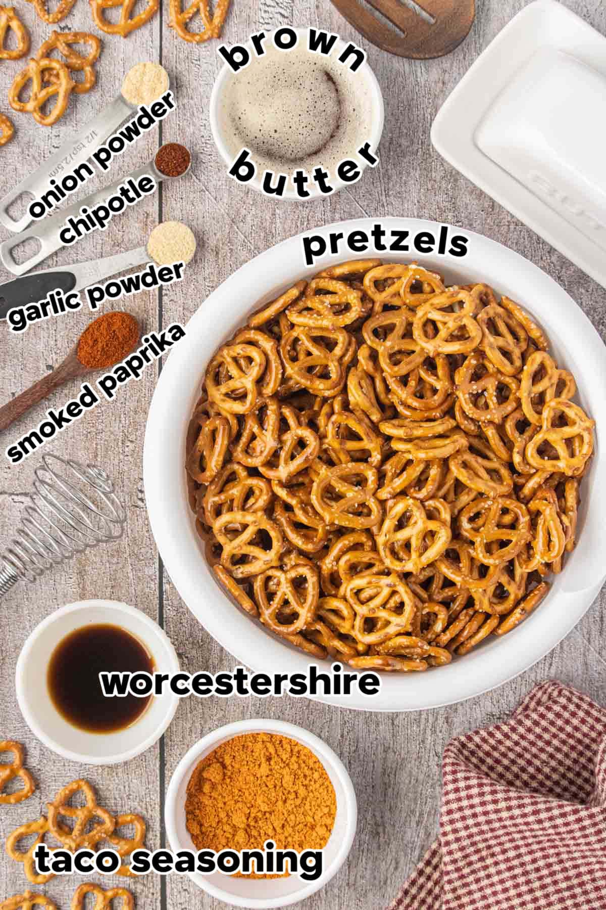 Ingredients for slow cooker taco pretzels including pretzels, taco seasoning, Worcestershire sauce, brown butter, smoked paprika, garlic powder, onion powder, and chipotle powder.