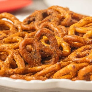 Side view of slow cooker taco pretzels showing the crunchy taco seasoning coating on each pretzel.